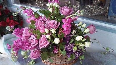 Purple&amp;amp; white roses in a wicker basket